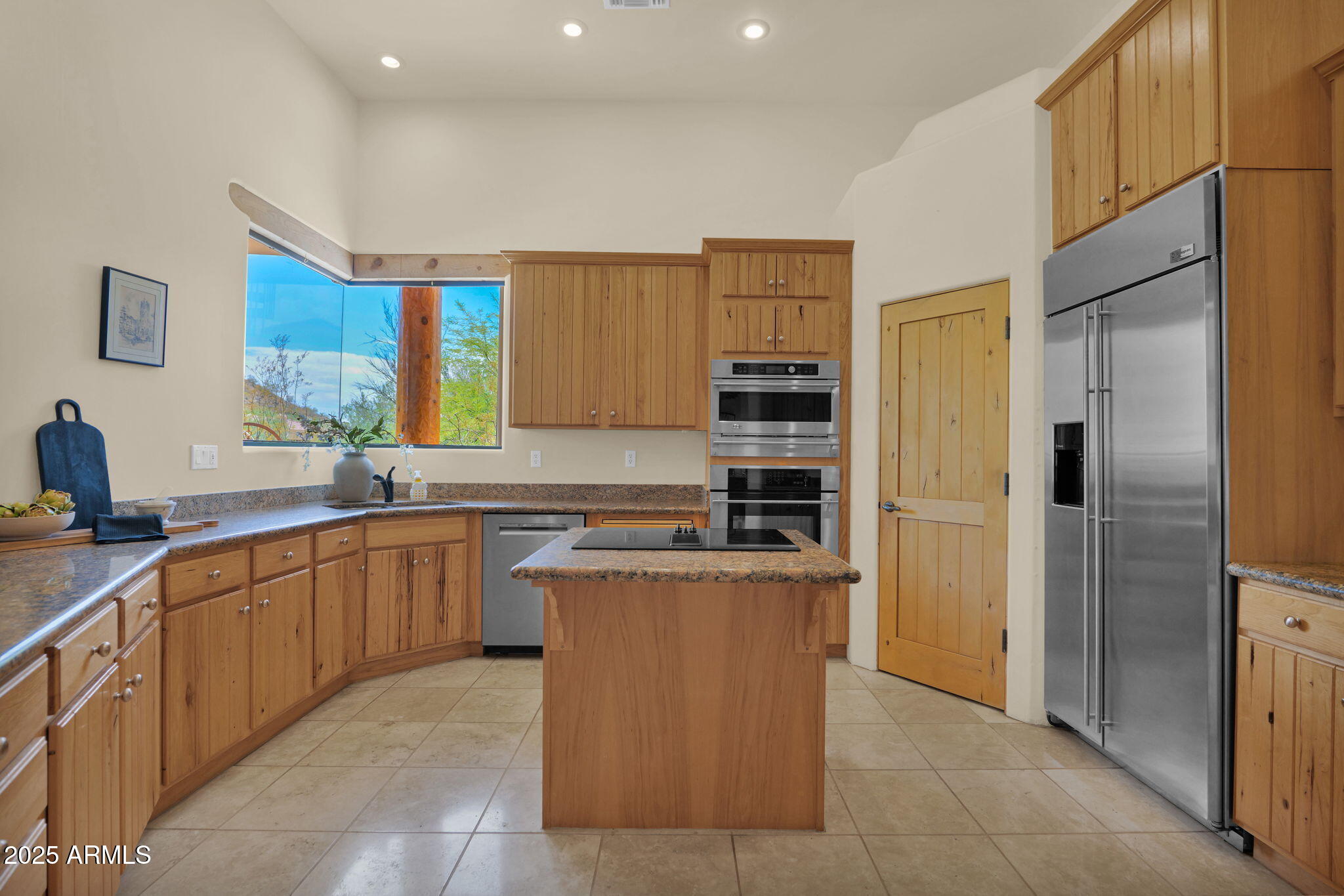 7130 East Saddleback Street, Unit 5 Mesa, AZ 85207 - Photo 20 of 57 a kitchen with stainless steel appliances granite countertop a refrigerator and a sink