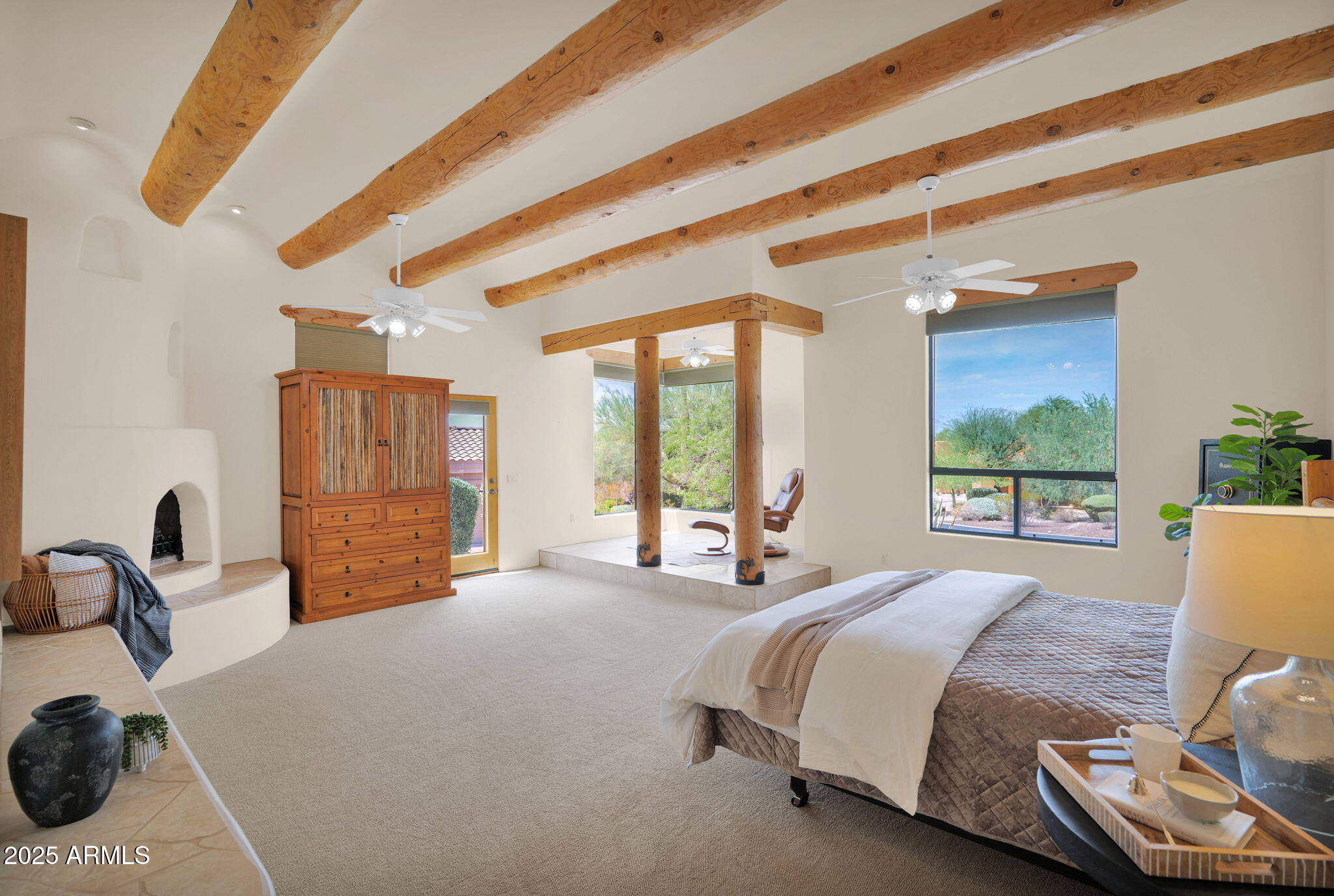 7130 East Saddleback Street, Unit 5 Mesa, AZ 85207 - Photo 22 of 57 a bed sitting in a bedroom next to a window