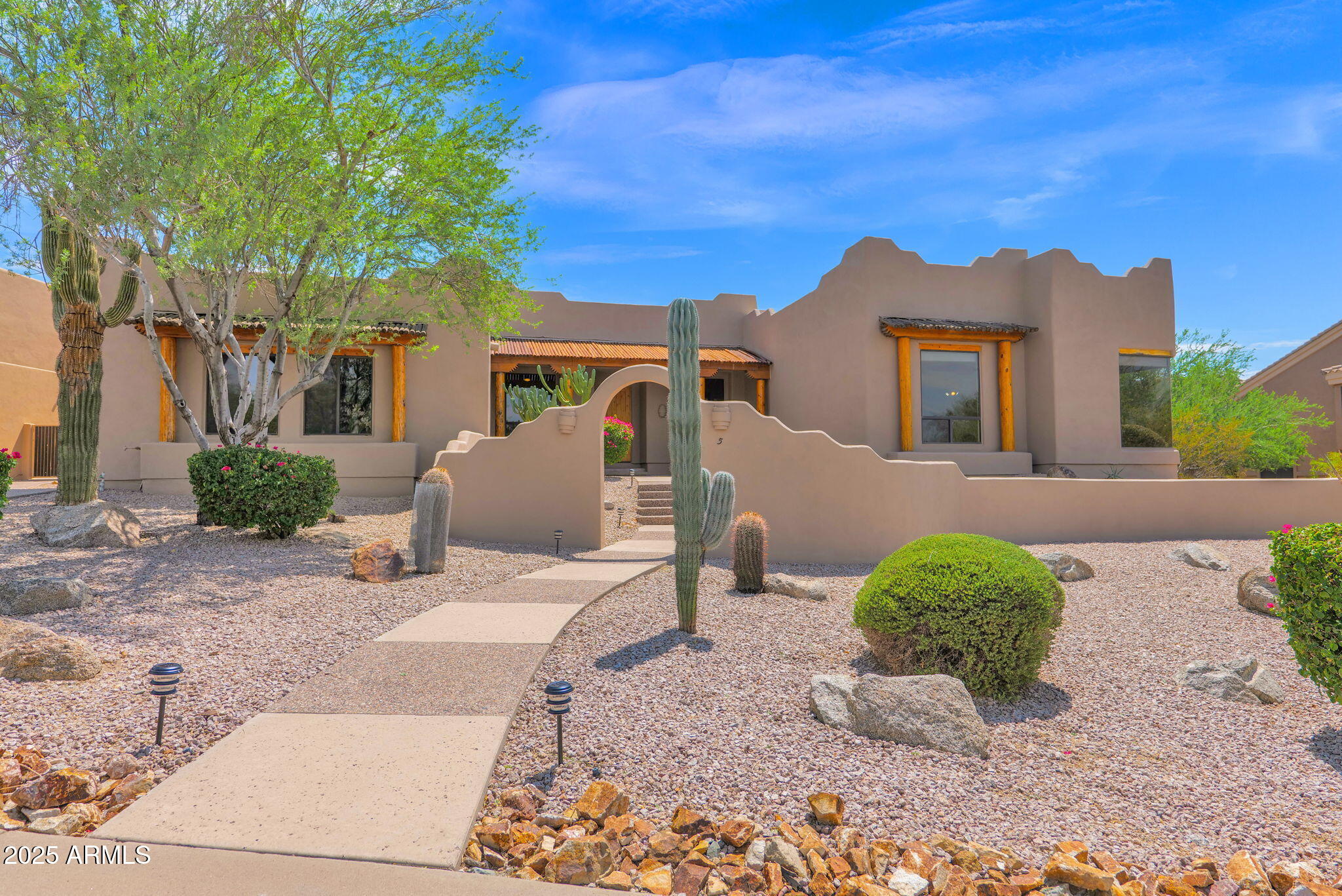 7130 East Saddleback Street, Unit 5 Mesa, AZ 85207 - Photo 2 of 57 a front view of a house with a yard