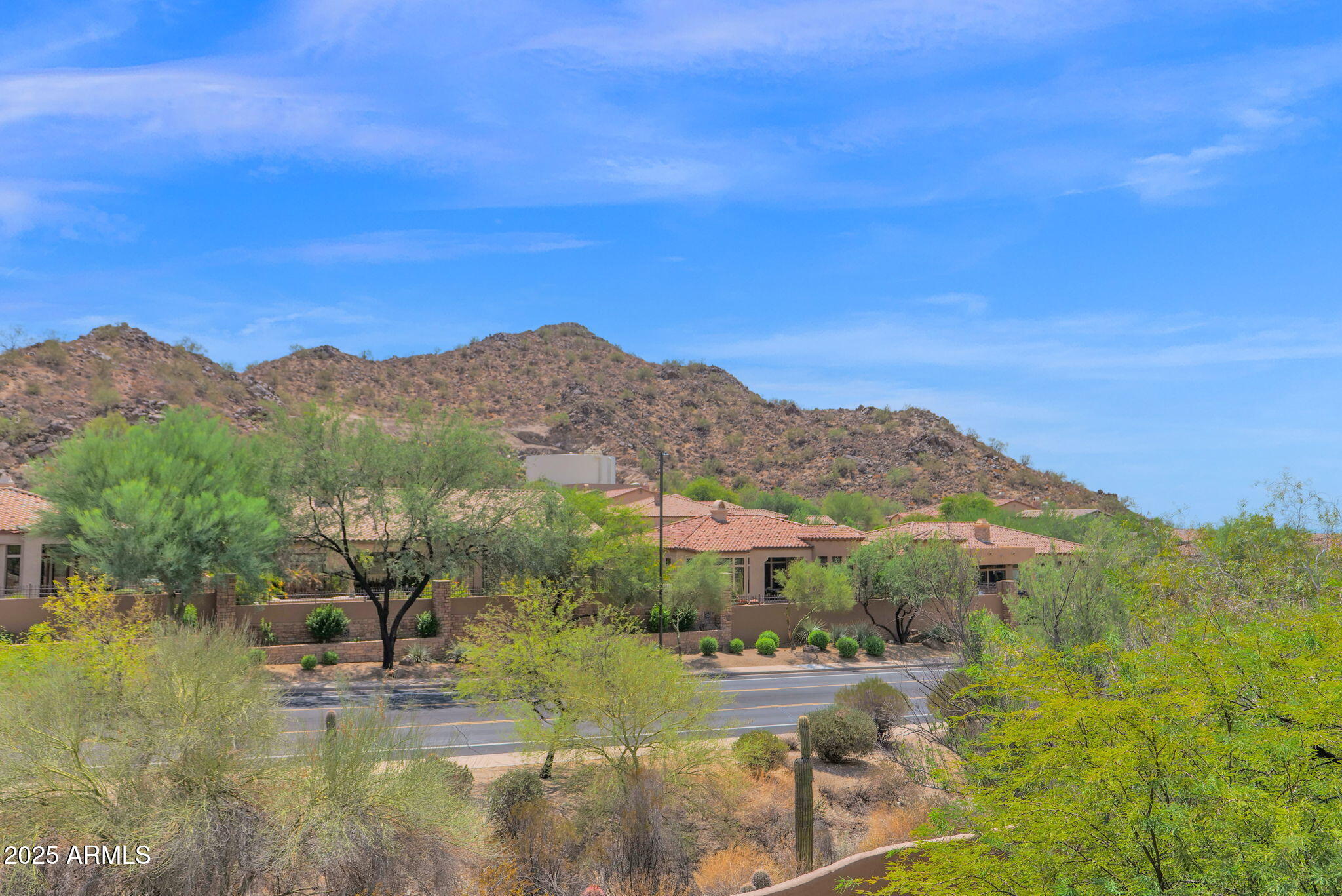 7130 East Saddleback Street, Unit 5 Mesa, AZ 85207 - Photo 40 of 57 a view of a lake with mountains in the background