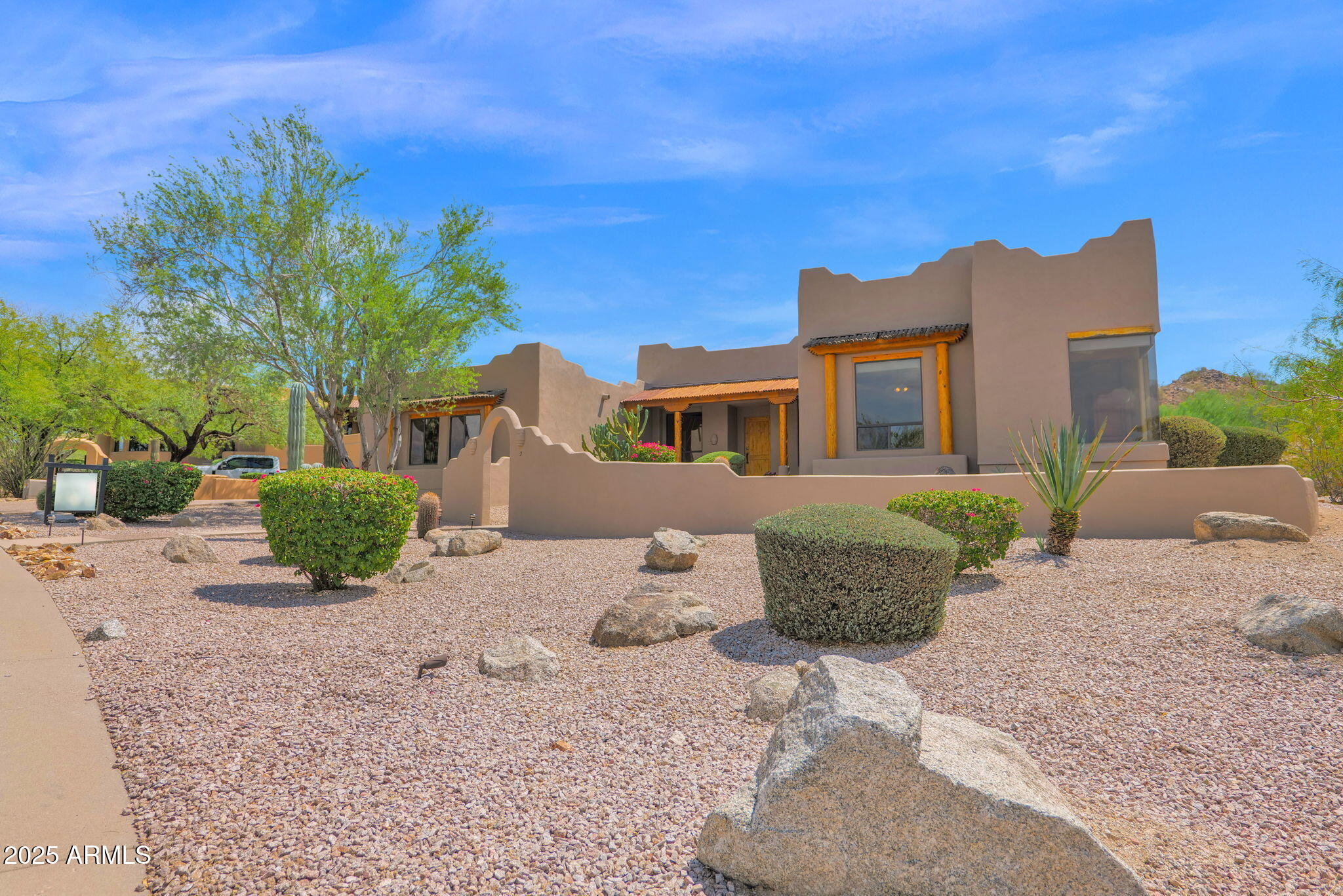 7130 East Saddleback Street, Unit 5 Mesa, AZ 85207 - Photo 43 of 57 a front view of a house with a yard