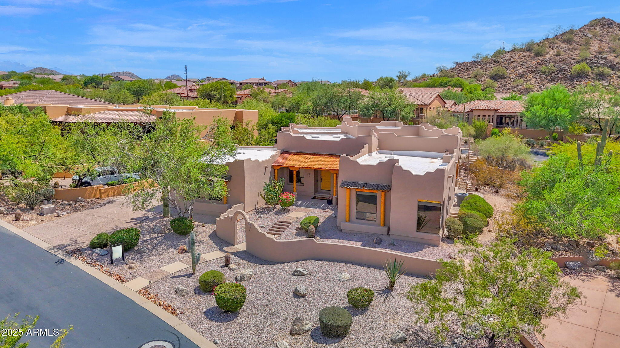 7130 East Saddleback Street, Unit 5 Mesa, AZ 85207 - Photo 4 of 57 an aerial view of residential houses with outdoor space