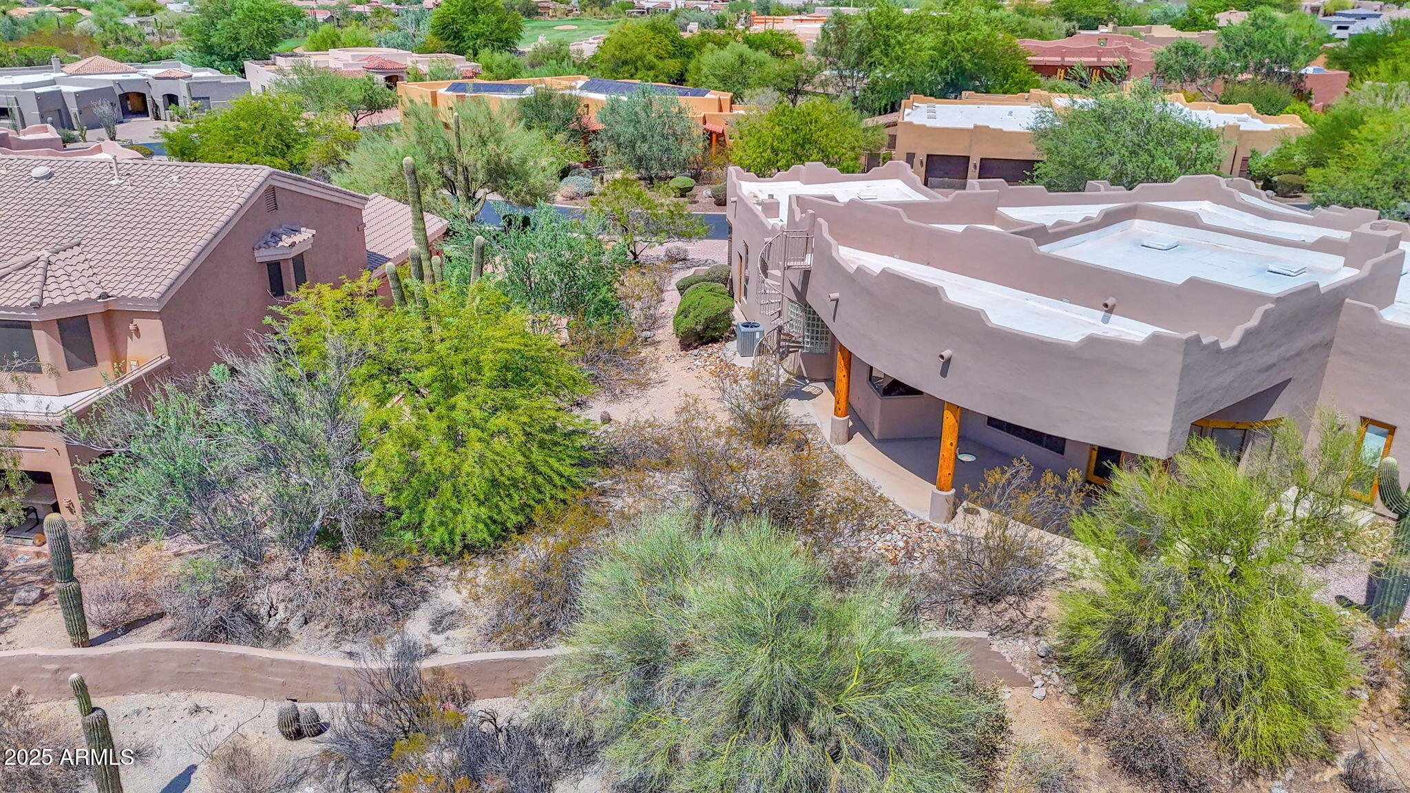7130 East Saddleback Street, Unit 5 Mesa, AZ 85207 - Photo 50 of 57 an aerial view of a house with yard and patio