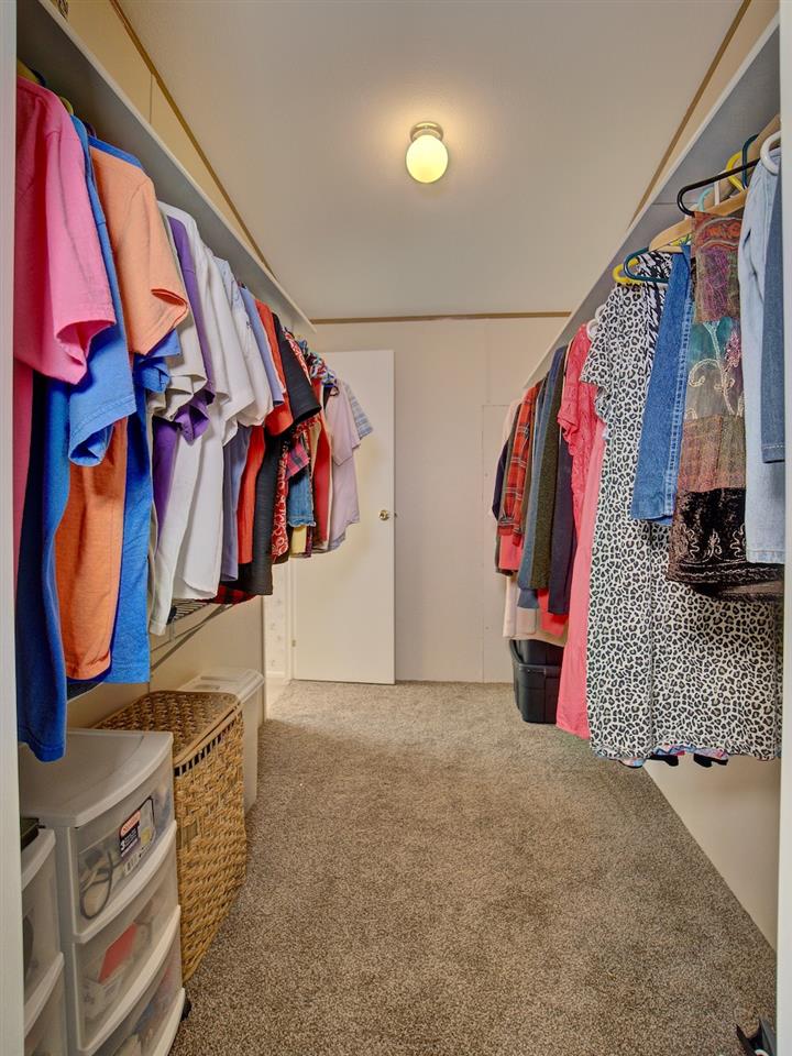 1317 Saddle Ridge Road Loma, CO 81524 - Photo 17 of 32 a view of walk in closet with clothes and shoes