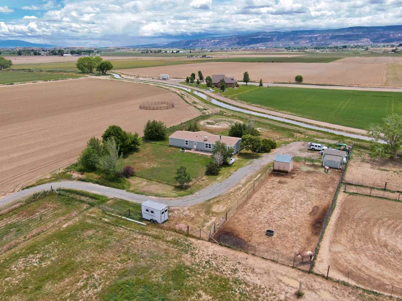 1317 Saddle Ridge Road Loma, CO 81524 - Photo 23 of 32 a view of a lake with a outdoor space