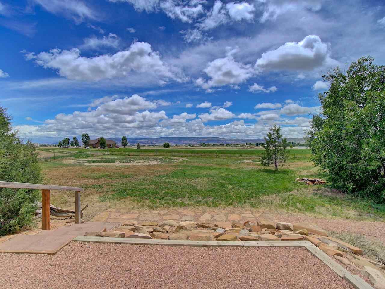 1317 Saddle Ridge Road Loma, CO 81524 - Photo 26 of 32 a view of a lake with a garden