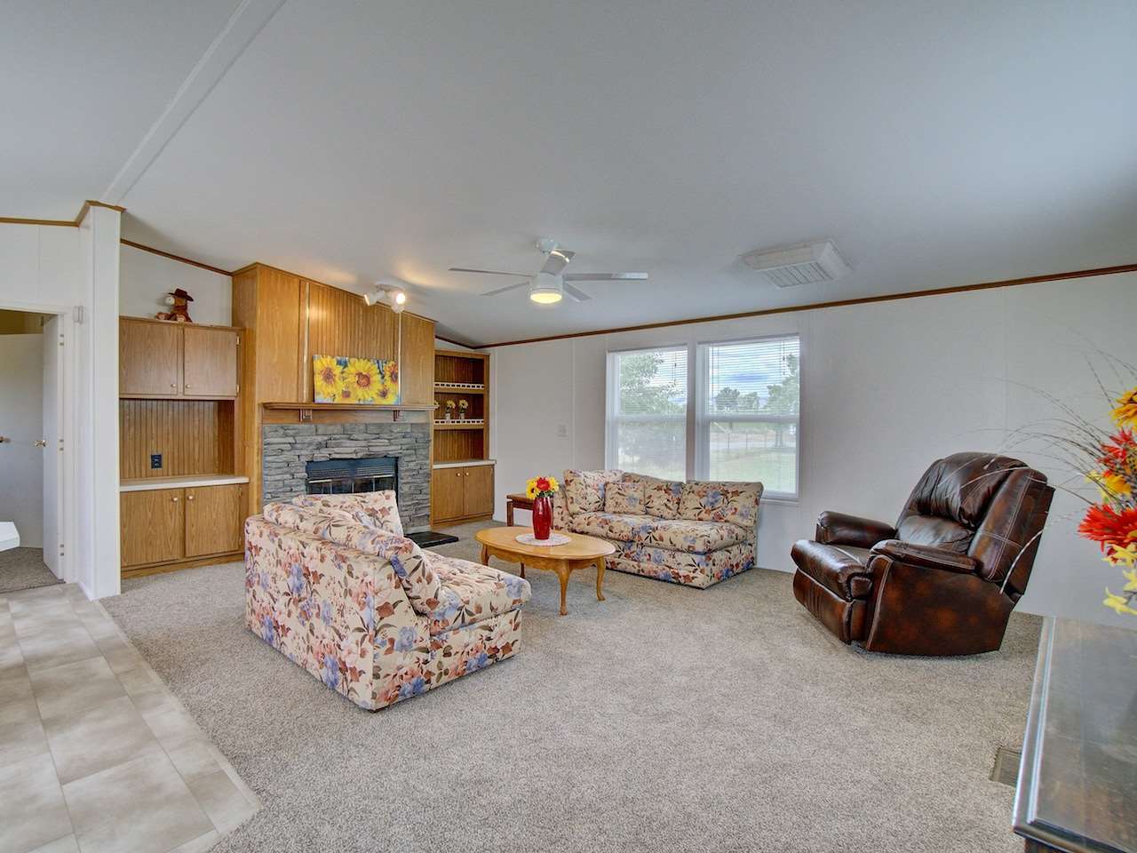 1317 Saddle Ridge Road Loma, CO 81524 - Photo 3 of 32 a living room with furniture and a fireplace