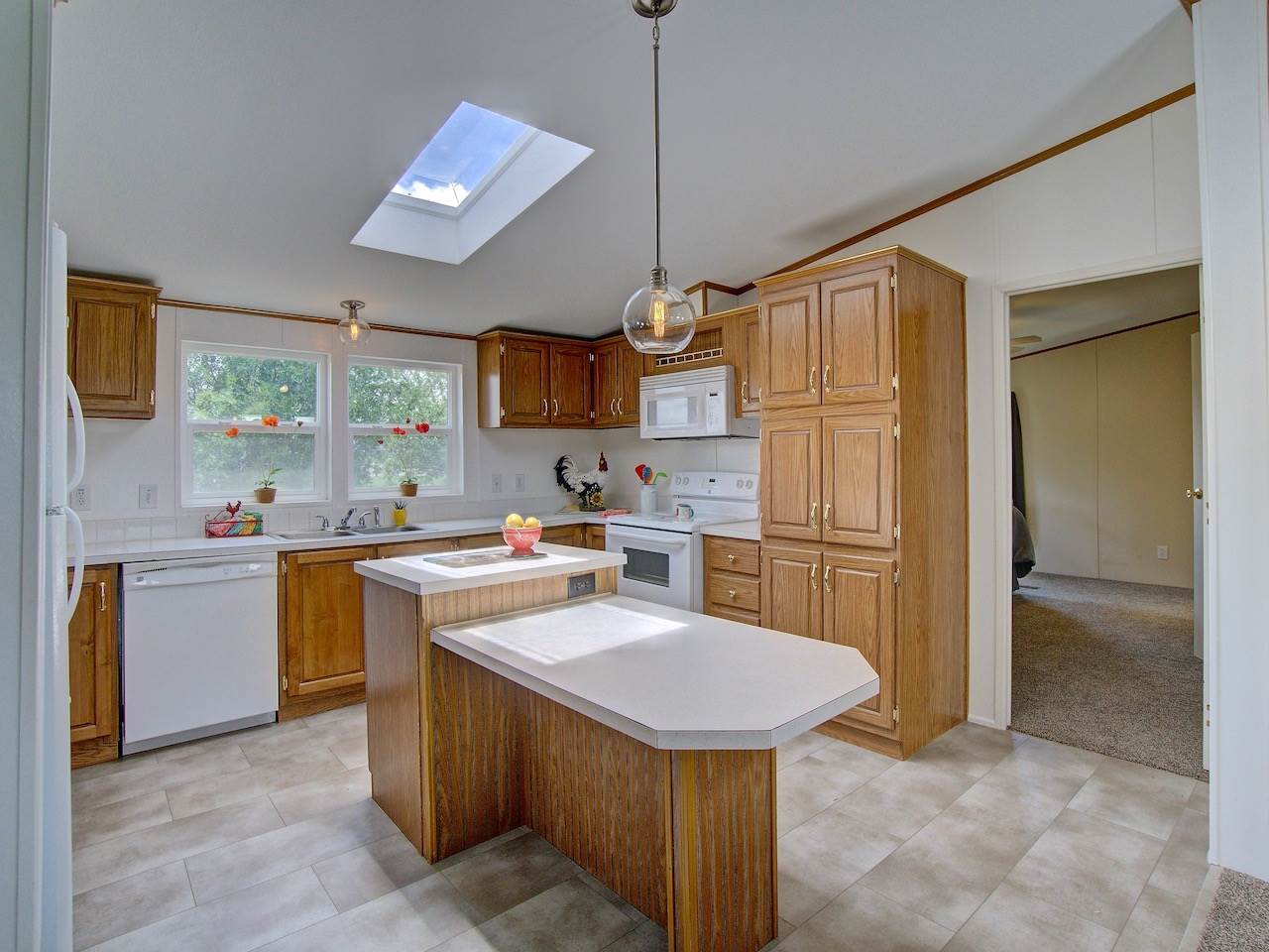 1317 Saddle Ridge Road Loma, CO 81524 - Photo 6 of 32 a kitchen with a sink appliances and cabinets
