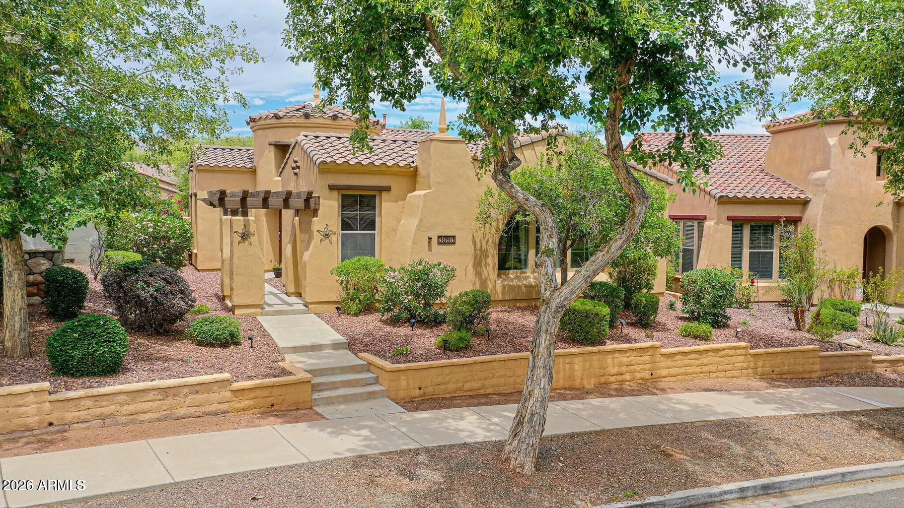 3950 North Edith Way Buckeye, AZ 85396 - Photo 4 of 32 a front view of a house with garden
