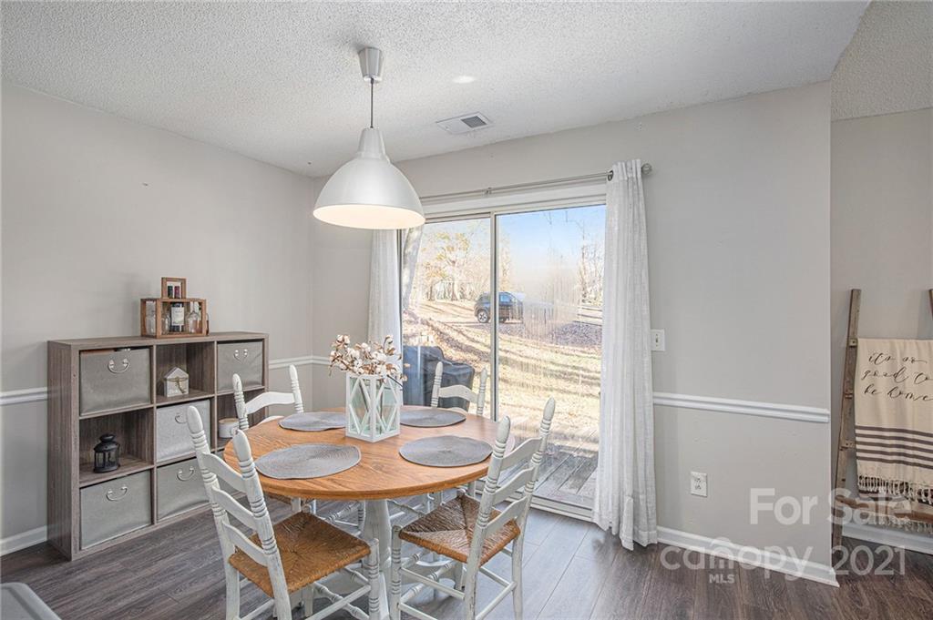 10227 Grand Junction Road Mint Hill, NC 28227 - Photo 20 of 27 a dining room with furniture window and wooden floor