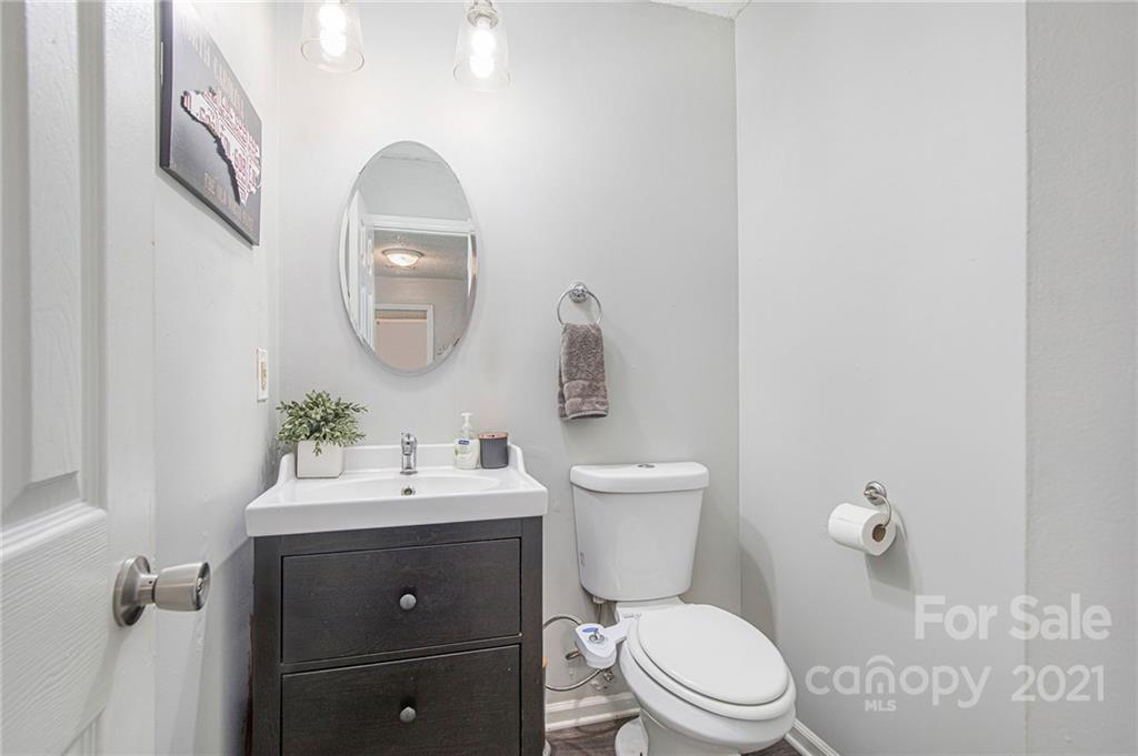 10227 Grand Junction Road Mint Hill, NC 28227 - Photo 24 of 27 a bathroom with a toilet sink and mirror