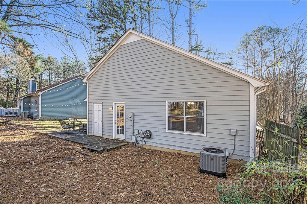 10227 Grand Junction Road Mint Hill, NC 28227 - Photo 6 of 27 a backyard of a house with seating space