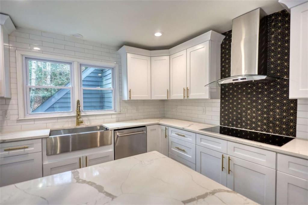 4205 Aberdeen Pass Roswell, GA 30075 - Photo 11 of 53 a kitchen with granite countertop a sink a stove and cabinets