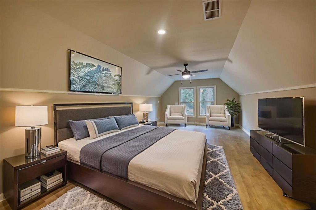 4205 Aberdeen Pass Roswell, GA 30075 - Photo 17 of 53 a spacious bedroom with a bed and a flat screen tv