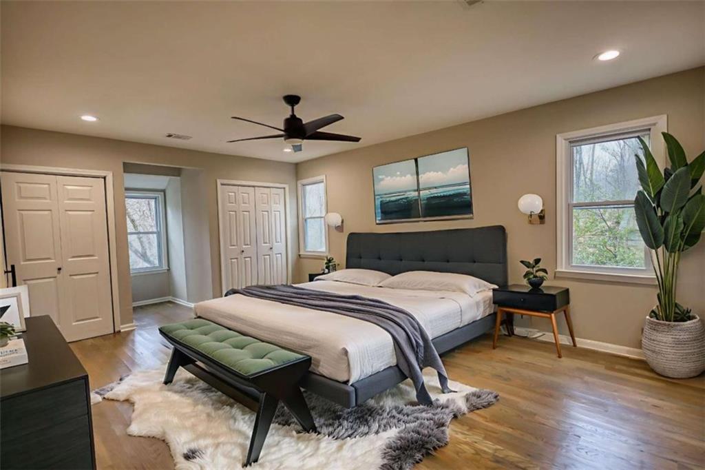 4205 Aberdeen Pass Roswell, GA 30075 - Photo 20 of 53 a bedroom with a bed a window and potted plant on dresser