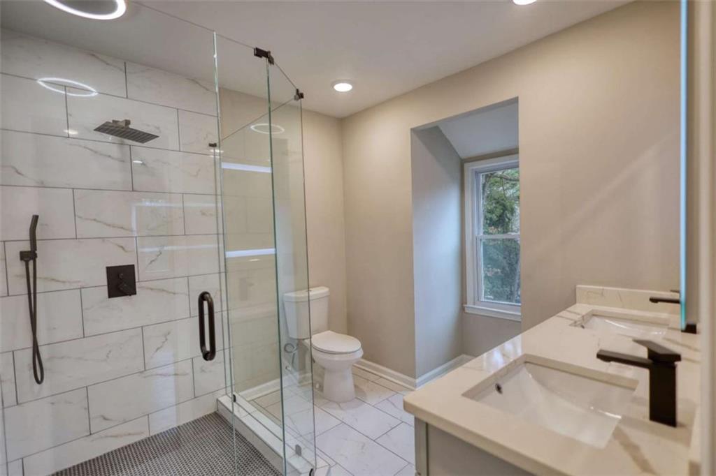 4205 Aberdeen Pass Roswell, GA 30075 - Photo 22 of 53 a bathroom with a sink toilet and shower