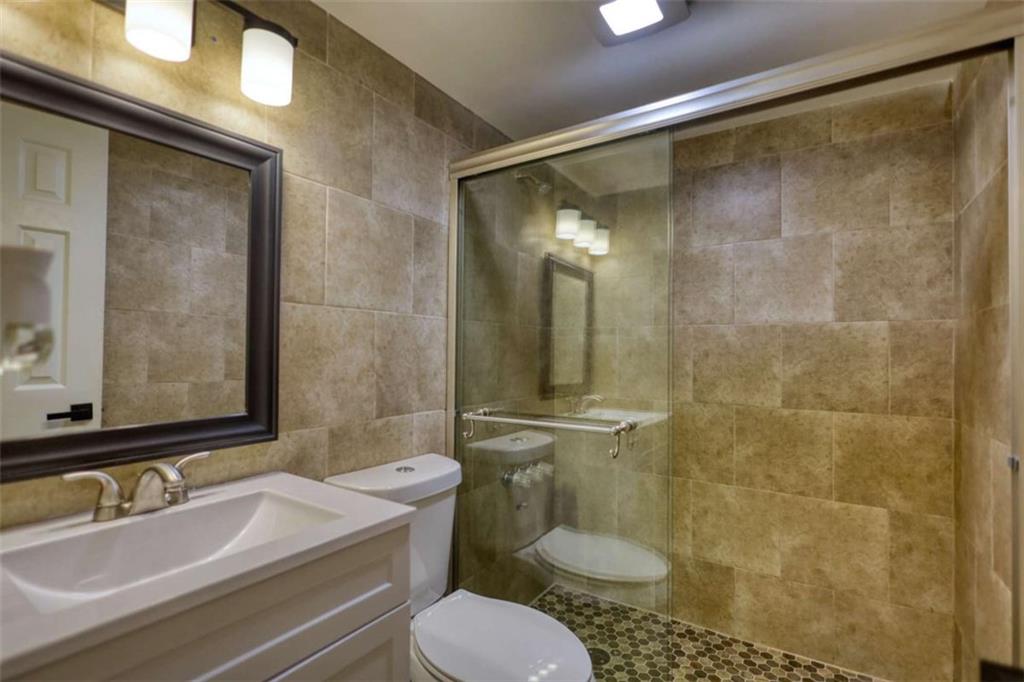 4205 Aberdeen Pass Roswell, GA 30075 - Photo 35 of 53 a bathroom with a sink toilet and shower