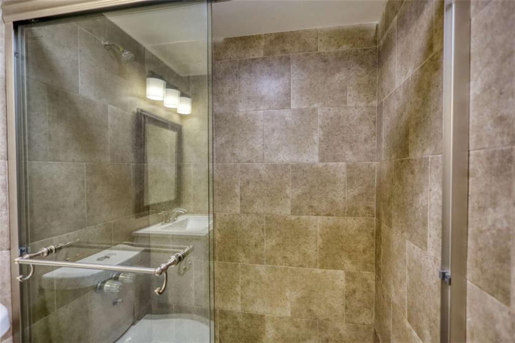 4205 Aberdeen Pass Roswell, GA 30075 - Photo 36 of 53 a bathroom with a sink toilet and shower