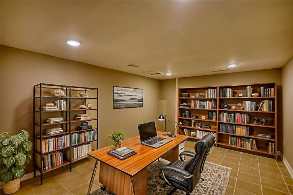 4205 Aberdeen Pass Roswell, GA 30075 - Photo 37 of 53 a view of a workspace with furniture and wooden floor
