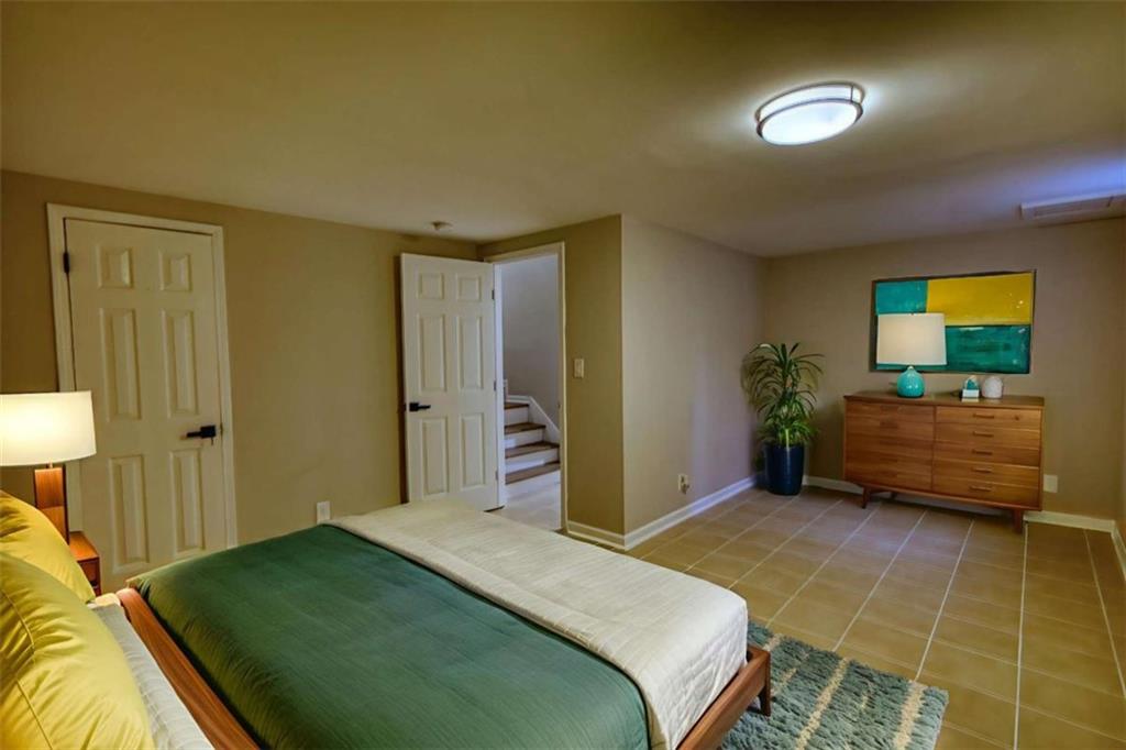 4205 Aberdeen Pass Roswell, GA 30075 - Photo 39 of 53 a bedroom with a bed and a dresser