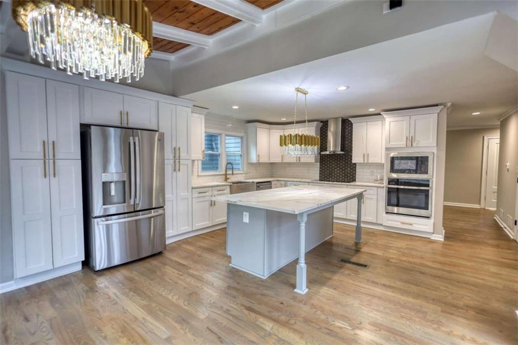 4205 Aberdeen Pass Roswell, GA 30075 - Photo 8 of 53 a kitchen with stainless steel appliances granite countertop a refrigerator a stove a sink and a oven