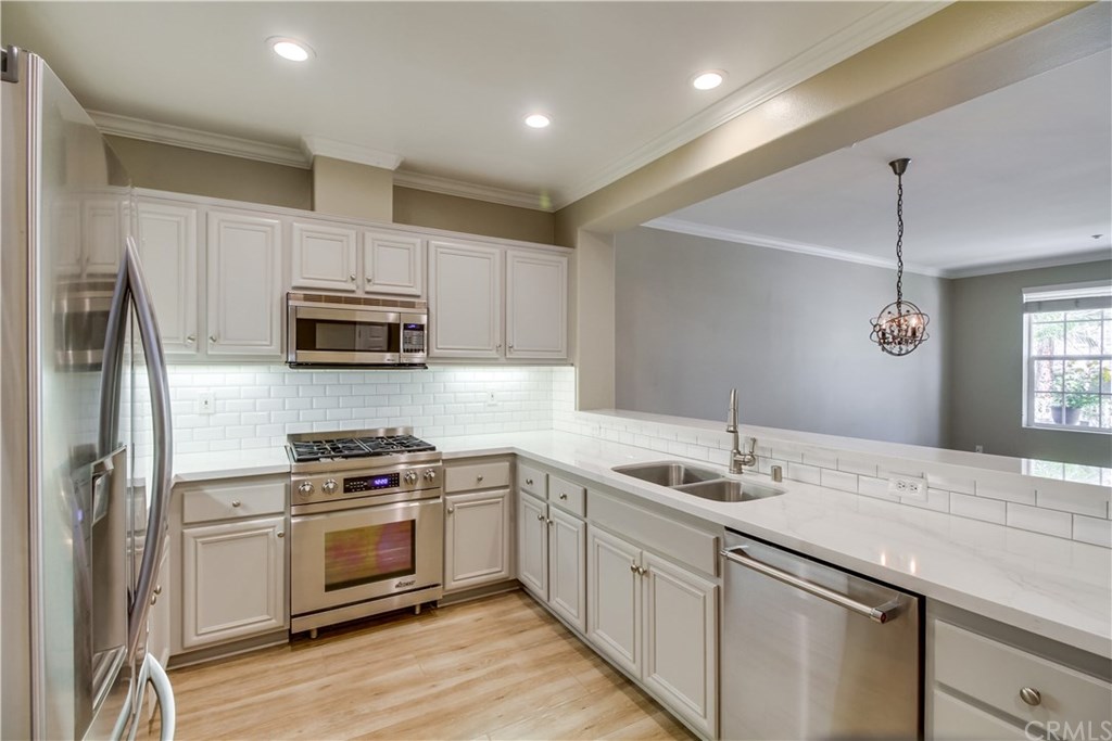 61 Strawflower Street Ladera Ranch, CA 92694 - Photo 1 of 1 Stainless Steel with Chef grade range and white subway tile