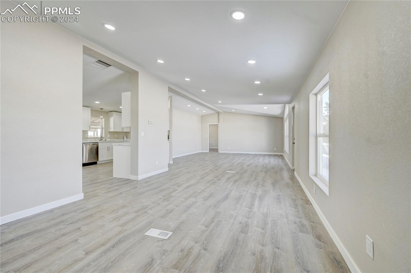 6605 Rio Road Peyton, CO 80831 - Photo 21 of 45 Unfurnished living room with light hardwood / wood-style flooring