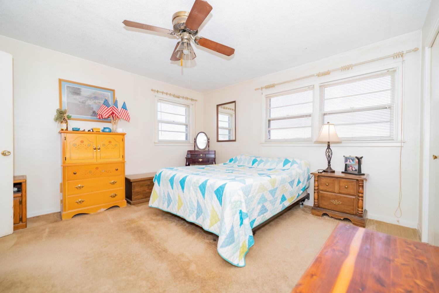 4811 43rd Street Lubbock, TX 79414 - Photo 17 of 20 a bedroom with a bed and a dresser