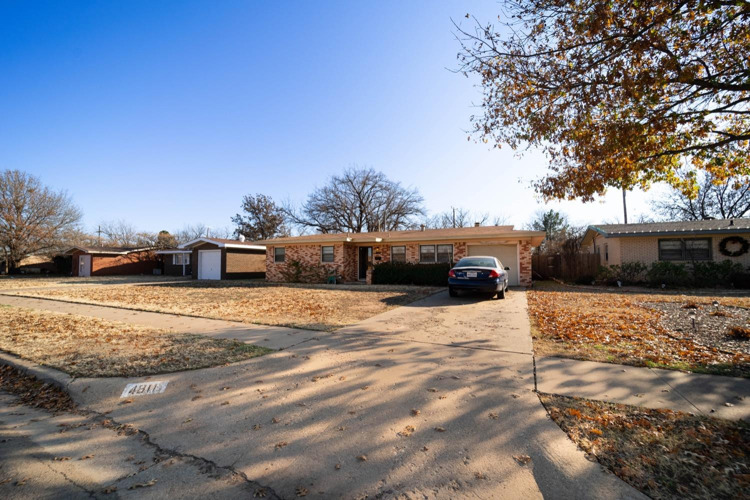 4811 43rd Street Lubbock, TX 79414 - Photo 2 of 20 a front view of a house with a yard