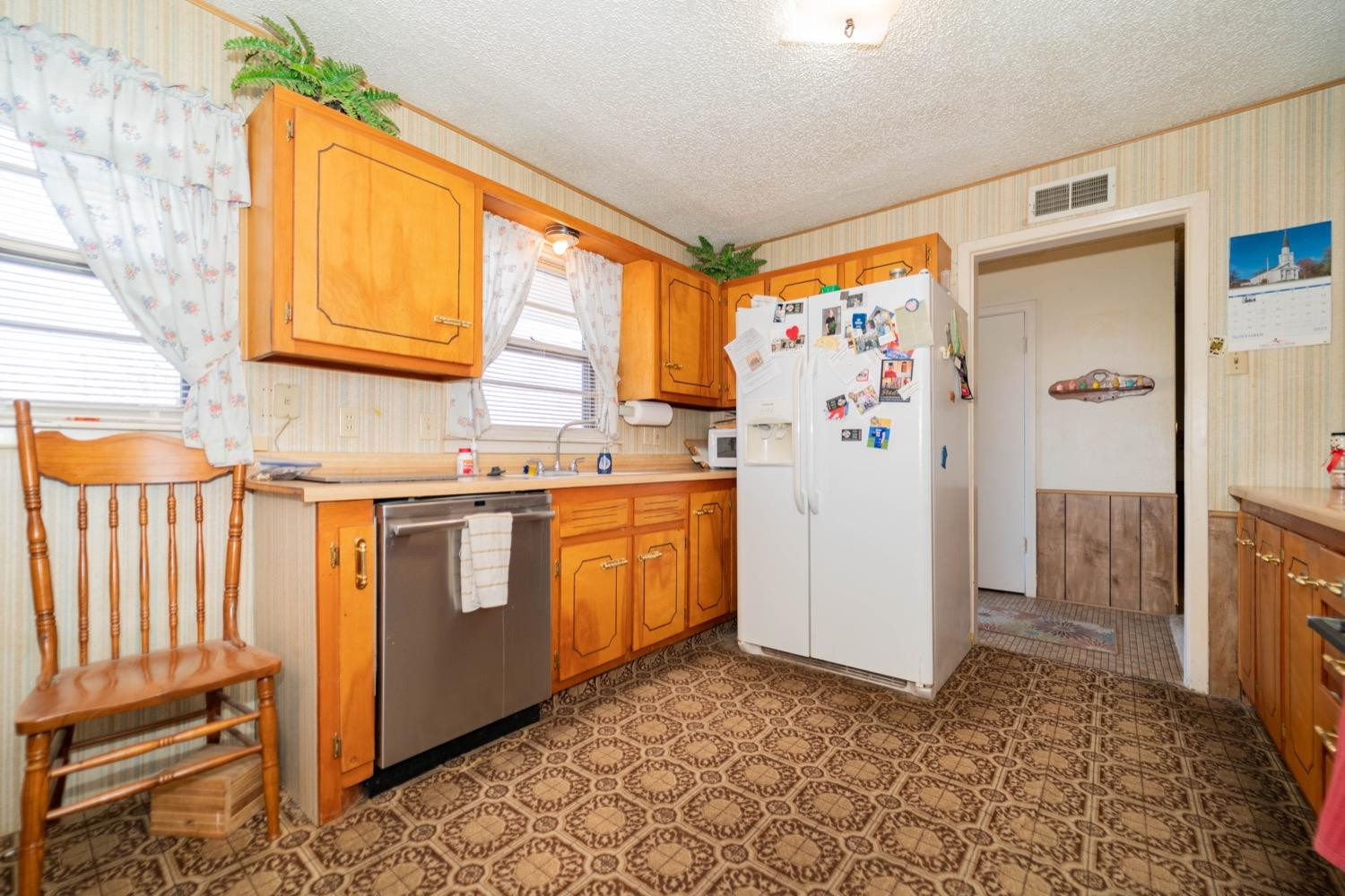 4811 43rd Street Lubbock, TX 79414 - Photo 7 of 20 a kitchen with stainless steel appliances a refrigerator and a stove