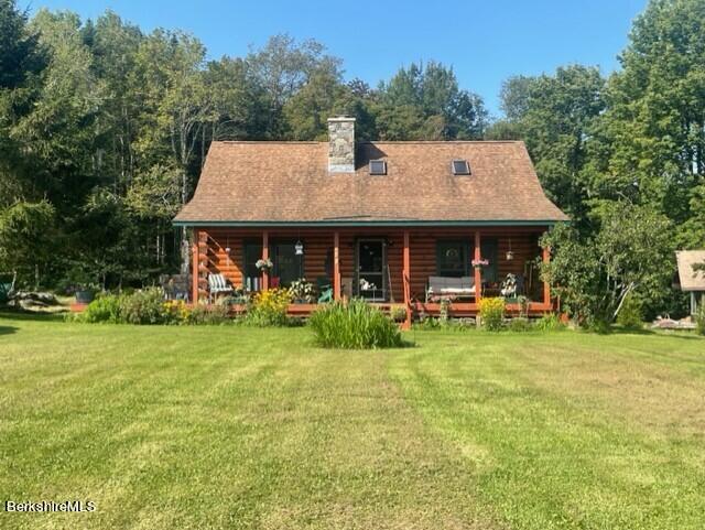 565 New State Road Savoy, MA 01256 - Photo 17 of 24 a front view of a house with swimming pool having outdoor seating