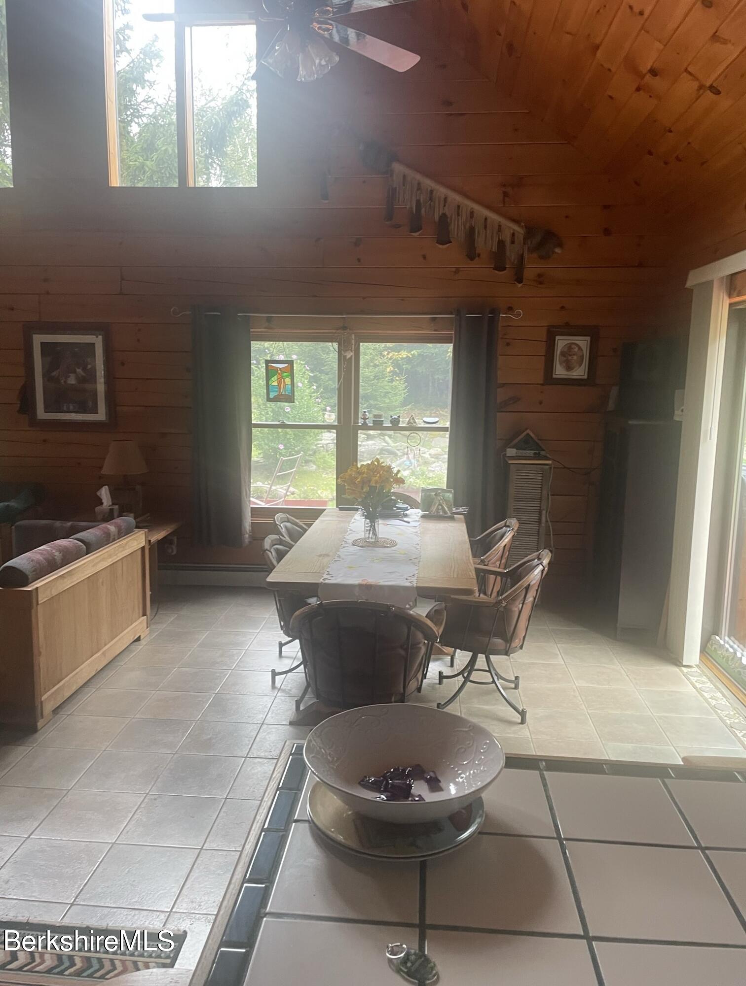 565 New State Road Savoy, MA 01256 - Photo 3 of 24 a kitchen with a table and a stove