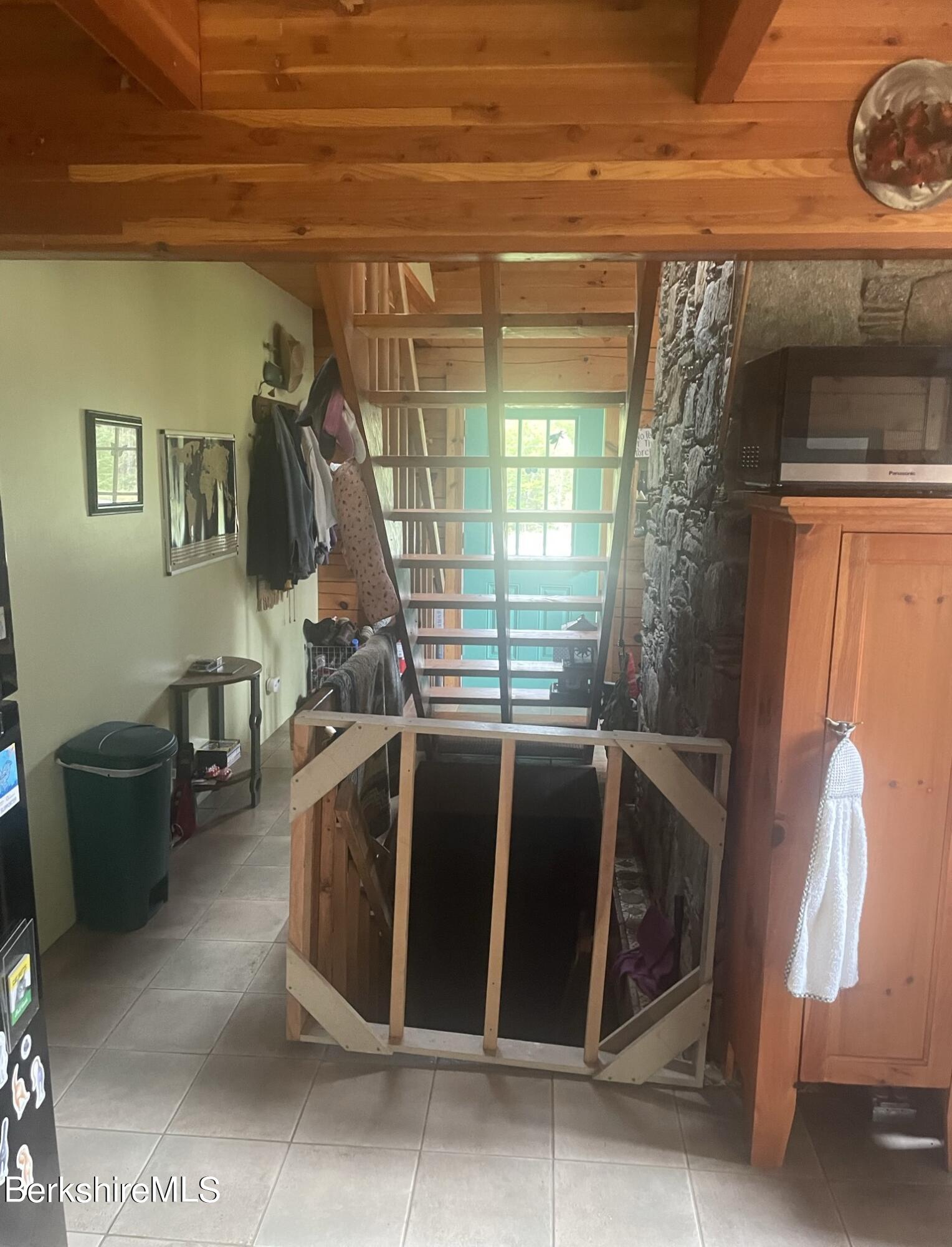 565 New State Road Savoy, MA 01256 - Photo 7 of 24 a bed sitting in a room next to a window