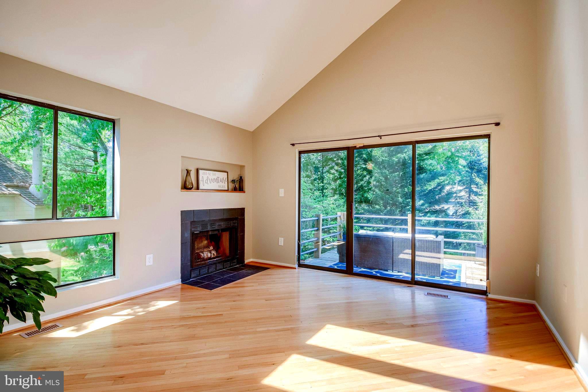 1656 Cedar Hollow Way Reston, VA 20194 - Photo 9 of 36 Walk out deck, window of glass to view of trees