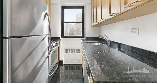 a view of a kitchen with a sink