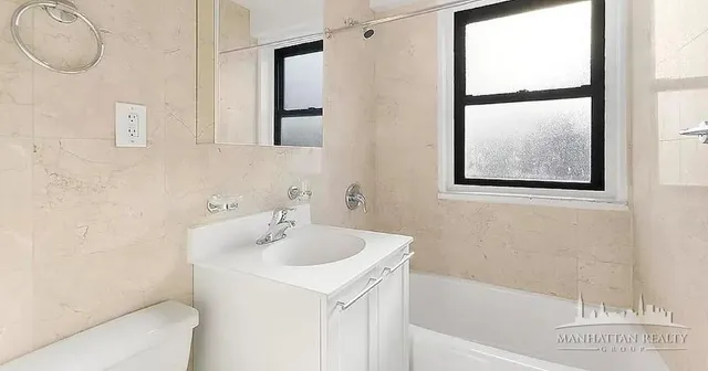 a bathroom with a sink and a bathtub