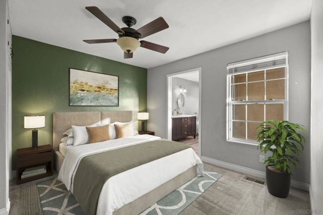 a bedroom with a bed and a potted plant