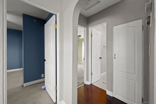 a view of a bathroom with wooden floor