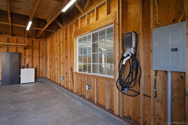 a view of a door with wooden walls