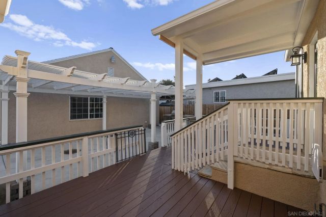 a view of balcony with wooden floor
