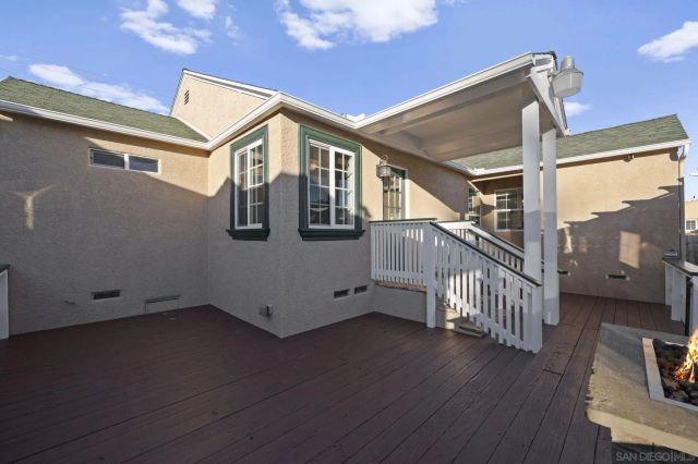 a view of a house with wooden fence