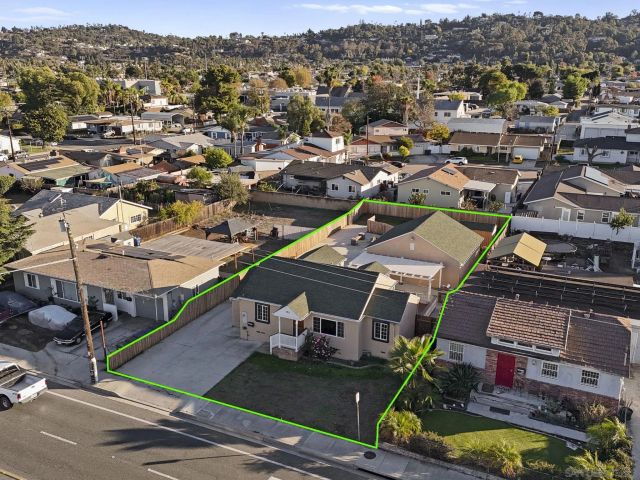 an aerial view of a house with a garden