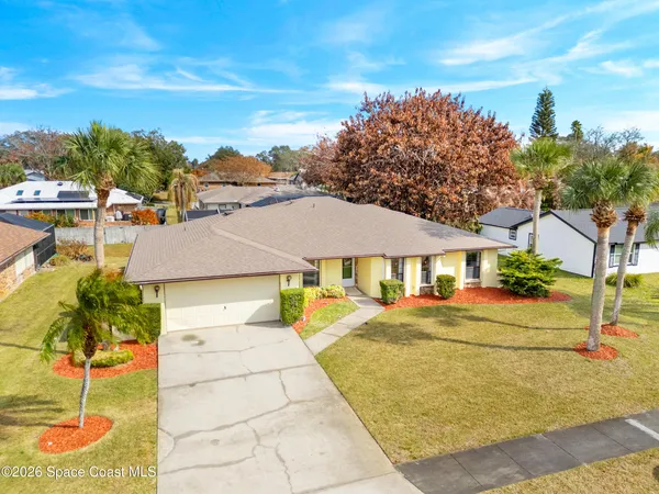 a house with trees in front of it