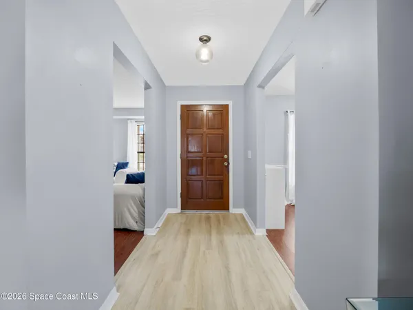 a view of bedroom with wooden floor