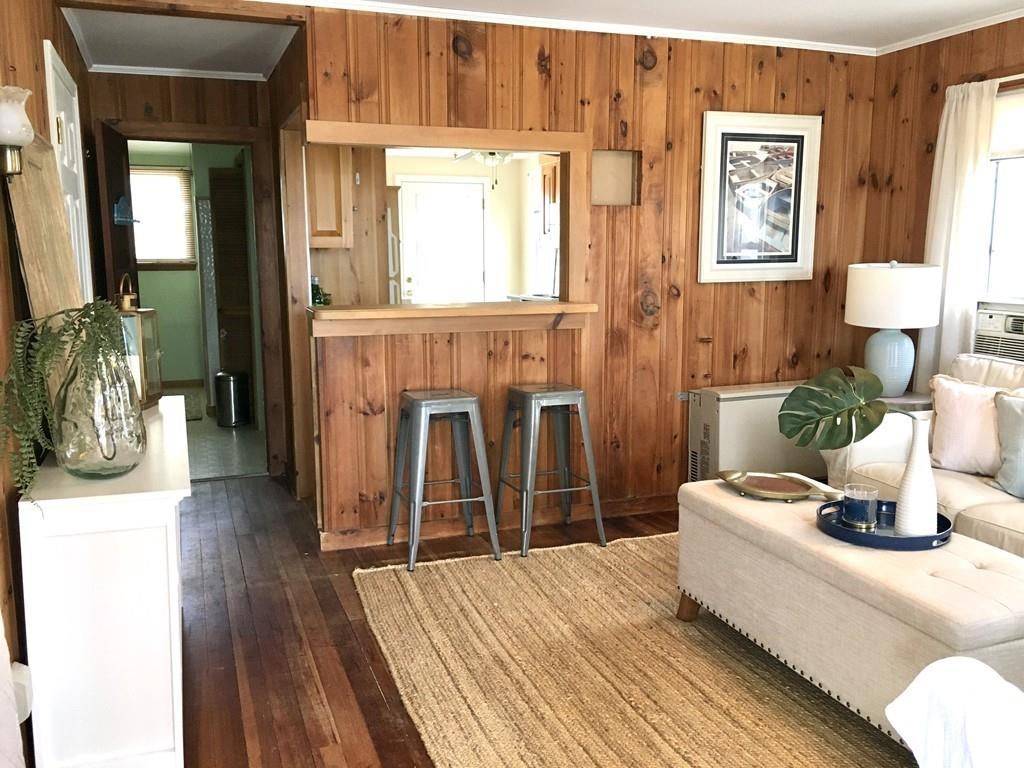 5 Barnacle Road Wareham, MA 02571 - Photo 11 of 28 a bedroom with a bed and wooden floor