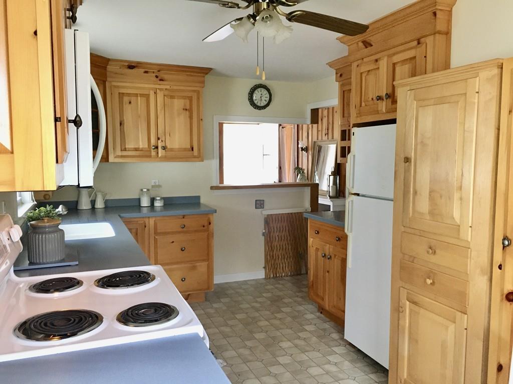 5 Barnacle Road Wareham, MA 02571 - Photo 16 of 28 a kitchen with a refrigerator and a sink