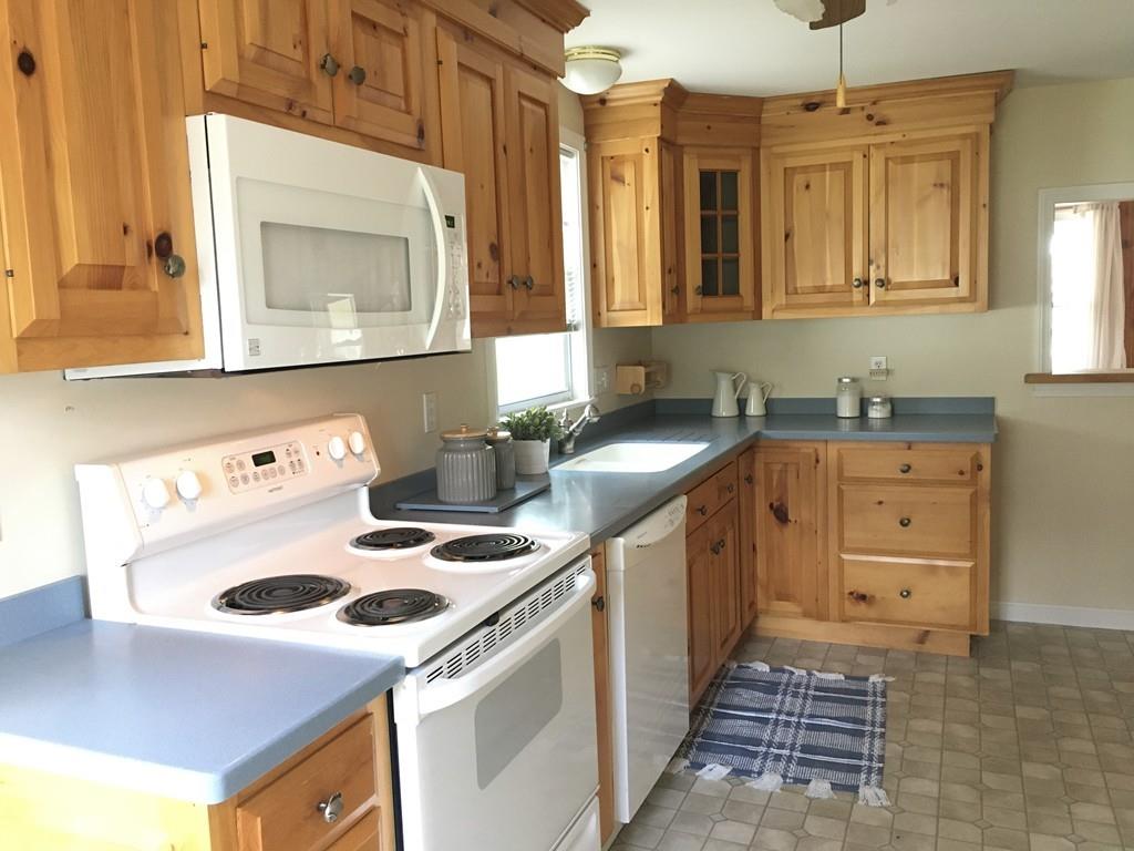 5 Barnacle Road Wareham, MA 02571 - Photo 17 of 28 a kitchen with a sink a stove and a microwave