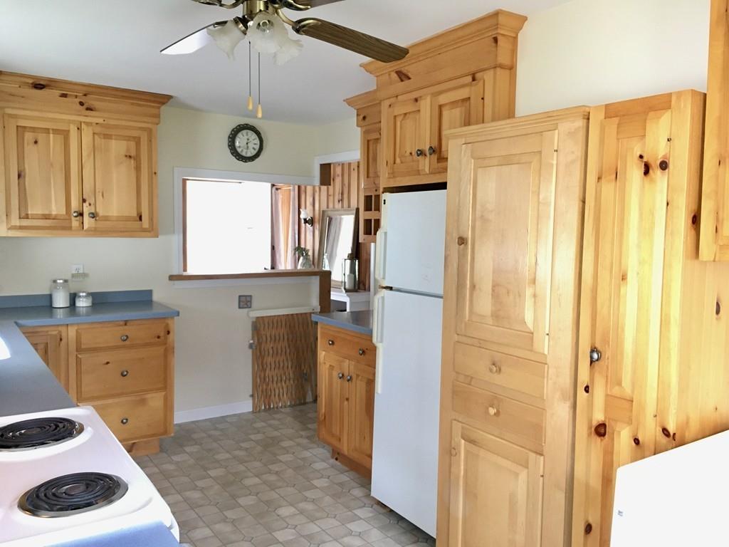 5 Barnacle Road Wareham, MA 02571 - Photo 18 of 28 a kitchen that has a refrigerator a sink and cabinets