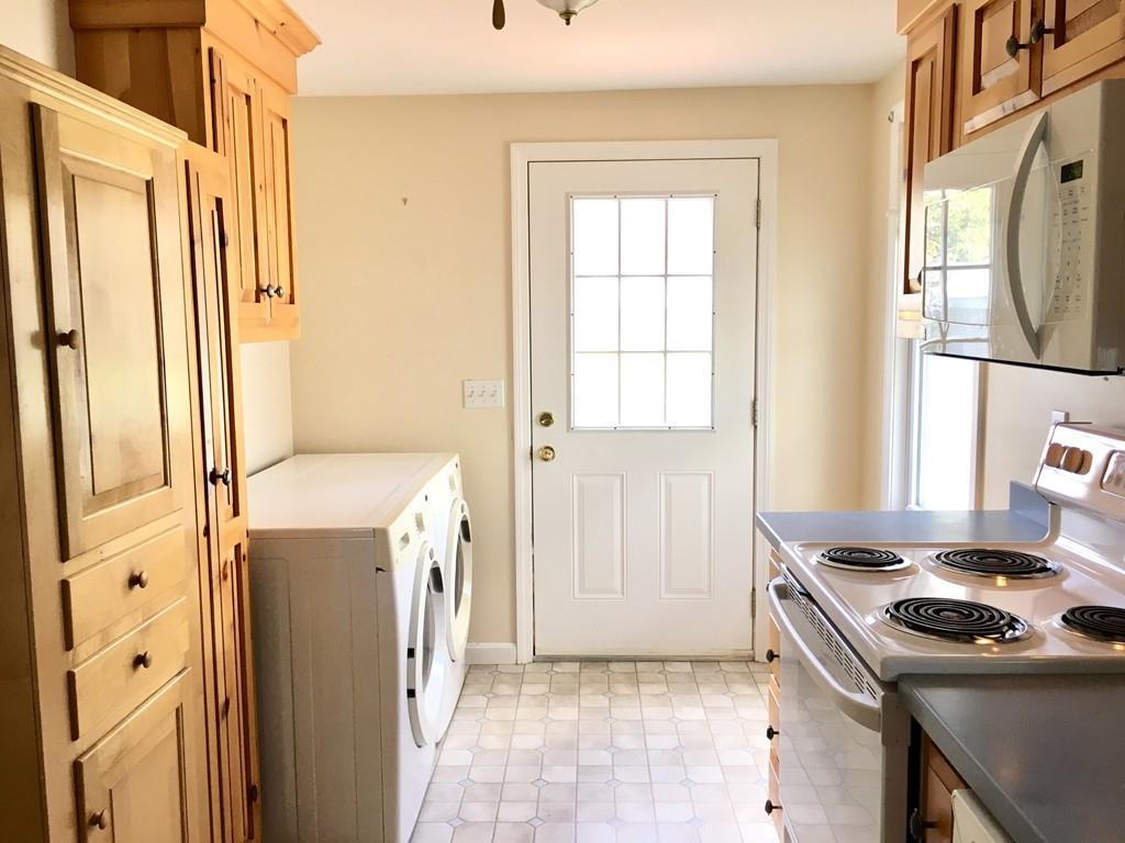 5 Barnacle Road Wareham, MA 02571 - Photo 19 of 28 a kitchen with a sink a stove and a refrigerator