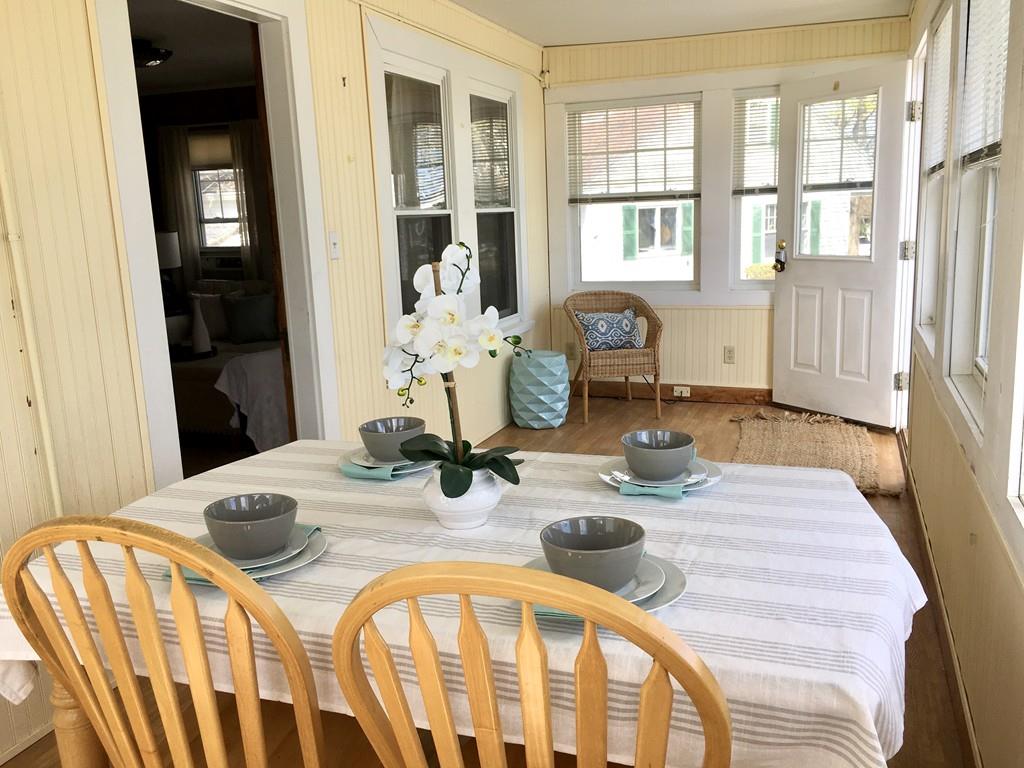 5 Barnacle Road Wareham, MA 02571 - Photo 8 of 28 a dining room with wooden floor and furniture